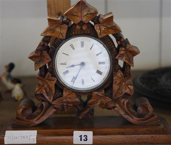Carved fruitwood cased French movement mantel clock
